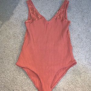 Orange lace back bodysuit